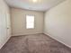 Simple bedroom with carpet, one window and door at 2452 Pearl Ridge Trce, Buford, GA 30519