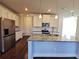 Modern kitchen island with granite countertop and stainless steel appliances at 2452 Pearl Ridge Trce, Buford, GA 30519