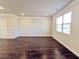 Large living room with hardwood floors and large window at 2452 Pearl Ridge Trce, Buford, GA 30519