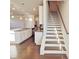 Modern staircase with white risers and dark wood treads at 2452 Pearl Ridge Trce, Buford, GA 30519