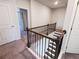 Upper level hallway with access to bedrooms and stairs at 2452 Pearl Ridge Trce, Buford, GA 30519