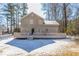 Rear exterior featuring an elevated deck, brick, and siding at 3049 Flat Shoals Rd, Atlanta, GA 30349