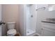 Bathroom featuring a single vanity, toilet, and standing shower at 3049 Flat Shoals Rd, Atlanta, GA 30349