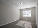 Neutral bedroom featuring a large window and soft carpeting at 3049 Flat Shoals Rd, Atlanta, GA 30349