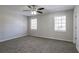 Bright bedroom featuring neutral walls, carpet floors, and a ceiling fan at 3049 Flat Shoals Rd, Atlanta, GA 30349