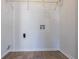 Laundry room featuring vinyl flooring, connections, and shelving at 3049 Flat Shoals Rd, Atlanta, GA 30349