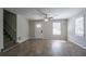 Bright living room features wood-look floors, fresh neutral paint, and staircase at 3049 Flat Shoals Rd, Atlanta, GA 30349