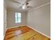 Well-lit bedroom featuring wood floors at 4230 Pilgrim Point Rd, Cumming, GA 30041