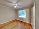 Bright bedroom with wood floors and ceiling fan at 4230 Pilgrim Point Rd, Cumming, GA 30041