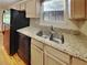 Kitchen with granite countertops and a double sink at 4230 Pilgrim Point Rd, Cumming, GA 30041