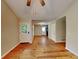 Bright living room featuring hardwood floors and access to other rooms at 4230 Pilgrim Point Rd, Cumming, GA 30041