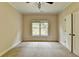 Bedroom with hardwood floors and ceiling fan at 7890 Royal Melbourne Way, Duluth, GA 30097