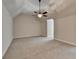 Spacious bonus room with neutral carpeting and a ceiling fan at 7890 Royal Melbourne Way, Duluth, GA 30097