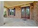 Brick front porch with double doors and sidelights at 7890 Royal Melbourne Way, Duluth, GA 30097