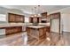 Gourmet kitchen with granite counters and dark wood cabinets at 7890 Royal Melbourne Way, Duluth, GA 30097