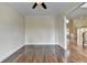 Bright home office features hardwood floors and neutral walls at 7890 Royal Melbourne Way, Duluth, GA 30097