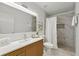 Modern bathroom with a large marble shower and updated vanity at 1669 Liberty Vly, Decatur, GA 30032