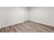 Empty bedroom with closet and wood-look floors at 1669 Liberty Vly, Decatur, GA 30032