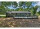 Exterior view of a ranch house with a deck and large backyard at 1669 Liberty Vly, Decatur, GA 30032