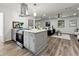 Modern kitchen island with stainless steel appliances and quartz countertop at 1669 Liberty Vly, Decatur, GA 30032