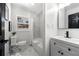 Updated bathroom with marble-look shower surround, new vanity, and sleek black hardware at 2277 Cloverdale Se Dr, Atlanta, GA 30316