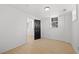 Freshly painted bedroom with luxury vinyl plank flooring and large window at 2277 Cloverdale Se Dr, Atlanta, GA 30316