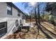 Exterior view of a white brick home and backyard featuring a stained deck and patio at 2277 Cloverdale Se Dr, Atlanta, GA 30316