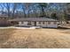 Single-story home with long carport and manicured front yard, with a new walkway to the front door at 2277 Cloverdale Se Dr, Atlanta, GA 30316