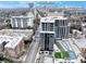 Aerial view of a modern apartment building with pool and tennis courts, near Lenox Mall at 2479 Peachtree Ne Rd # 802, Atlanta, GA 30305