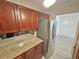 Kitchen features granite countertops and stainless steel refrigerator at 2479 Peachtree Ne Rd # 802, Atlanta, GA 30305