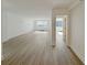 Open living room with hardwood floors and access to bedroom at 2479 Peachtree Ne Rd # 802, Atlanta, GA 30305