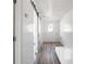 Hallway with sliding barn door and hardwood floors at 3845 Springleaf Ct, Stone Mountain, GA 30083