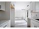 Modern kitchen featuring white cabinets and marble countertops at 3845 Springleaf Ct, Stone Mountain, GA 30083