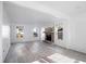 Spacious living room with stone fireplace and gray vinyl flooring at 3845 Springleaf Ct, Stone Mountain, GA 30083