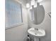 Simple bathroom with pedestal sink and oval mirror at 392 Vine St, Atlanta, GA 30314