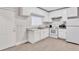 White kitchen with ample cabinet space and tile floor at 392 Vine St, Atlanta, GA 30314