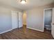 Spacious bedroom with hardwood floors and double doors at 6242 Prestley Mill Rd, Douglasville, GA 30134