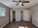 Spacious bedroom with hardwood floors and ample closet space at 6242 Prestley Mill Rd, Douglasville, GA 30134