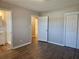 Spacious bedroom with hardwood floors and access to bathroom at 6242 Prestley Mill Rd, Douglasville, GA 30134