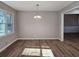 Spacious dining area with hardwood floors and neutral walls at 6242 Prestley Mill Rd, Douglasville, GA 30134