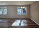 Bright dining room with hardwood floors and large windows at 6242 Prestley Mill Rd, Douglasville, GA 30134