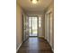 Bright entryway with grey door and wood-look floors at 6242 Prestley Mill Rd, Douglasville, GA 30134