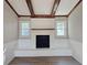 White brick fireplace with wood mantel in living room at 6242 Prestley Mill Rd, Douglasville, GA 30134