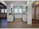 Modern white kitchen with granite countertops at 6242 Prestley Mill Rd, Douglasville, GA 30134