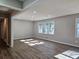 Spacious living room with wood-look floors and large windows at 6242 Prestley Mill Rd, Douglasville, GA 30134