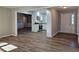 Open living room and kitchen with wood-look floors at 6242 Prestley Mill Rd, Douglasville, GA 30134