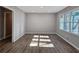 Sunlit living room with wood-look floors at 6242 Prestley Mill Rd, Douglasville, GA 30134