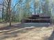 Open yard with a covered structure providing ample parking or storage at 6242 Prestley Mill Rd, Douglasville, GA 30134