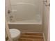 Simple bathroom with a toilet, and bathtub shower combination at 7981 Gossamer Dr, Fairburn, GA 30213