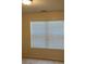 A well-lit bedroom features a window with blinds at 7981 Gossamer Dr, Fairburn, GA 30213